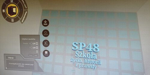 Ekran komputera. Na ekranie niebieski napis SP48 Szkoła życia, historii i prawdy.